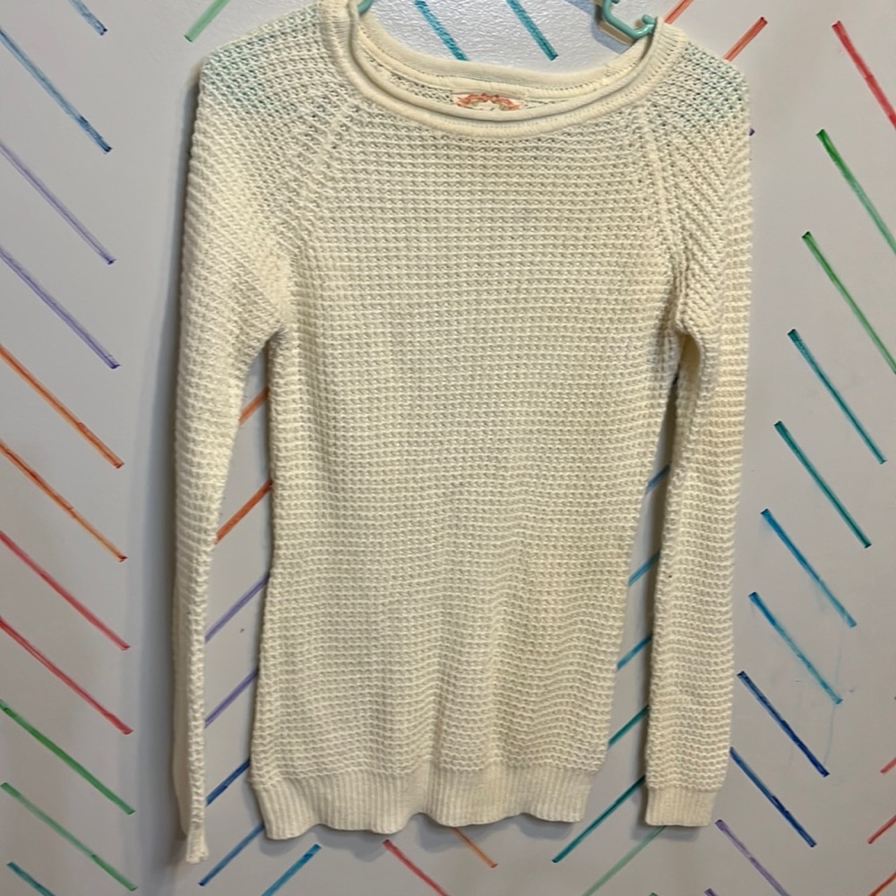 White sweater.